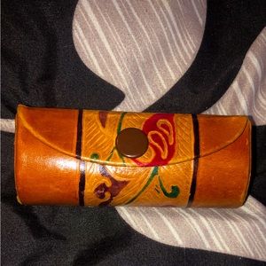 Leather lipstick case.